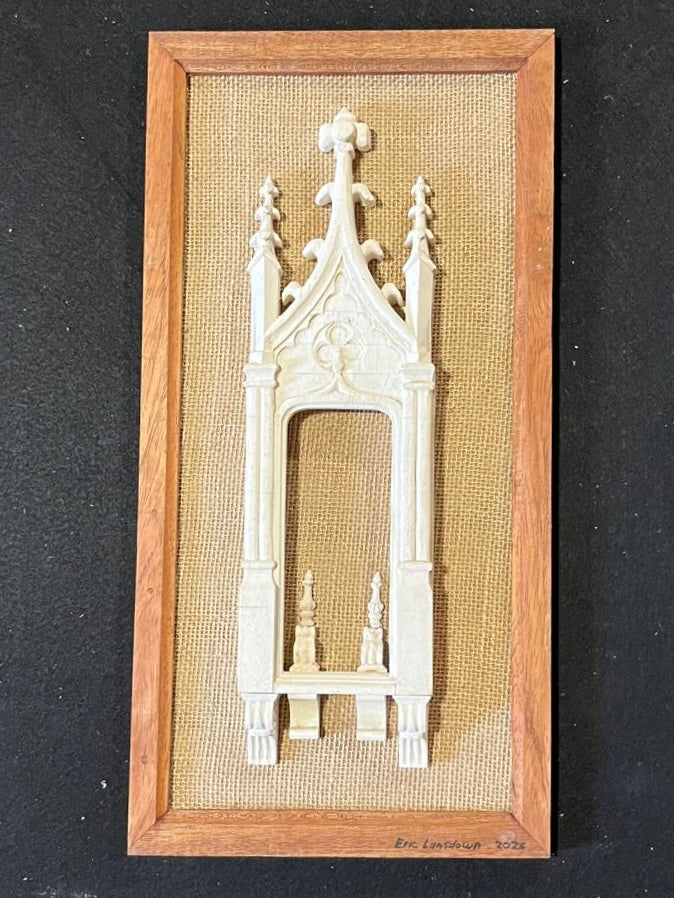Close frontal view of Architectural Archive No. 07 showing its Gothic portal, pointed tracery and carved plaster ornament within a wooden frame
