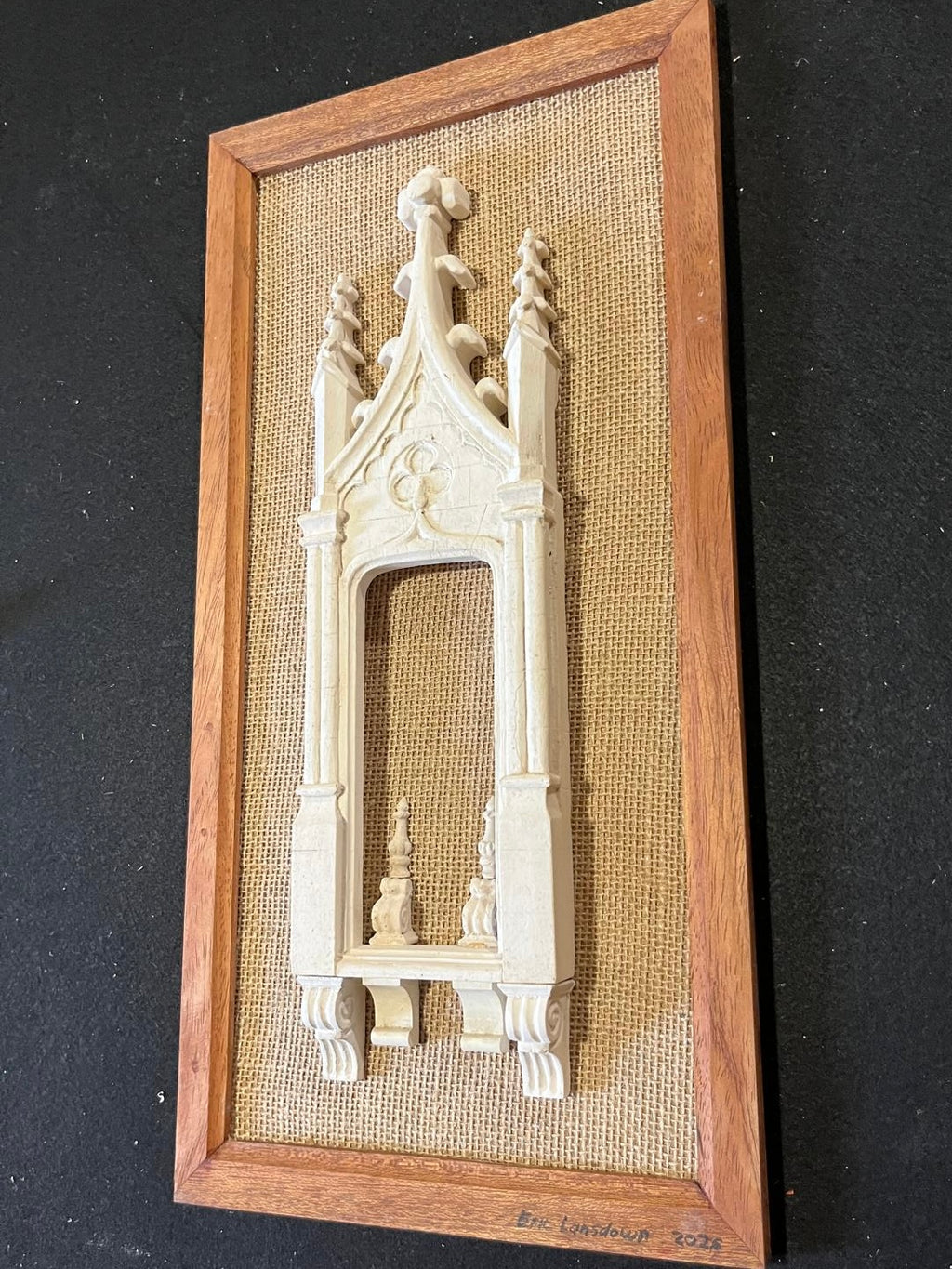 Angled view of Architectural Archive No. 07 showing the depth of its hand-cast Gothic relief against woven hessian