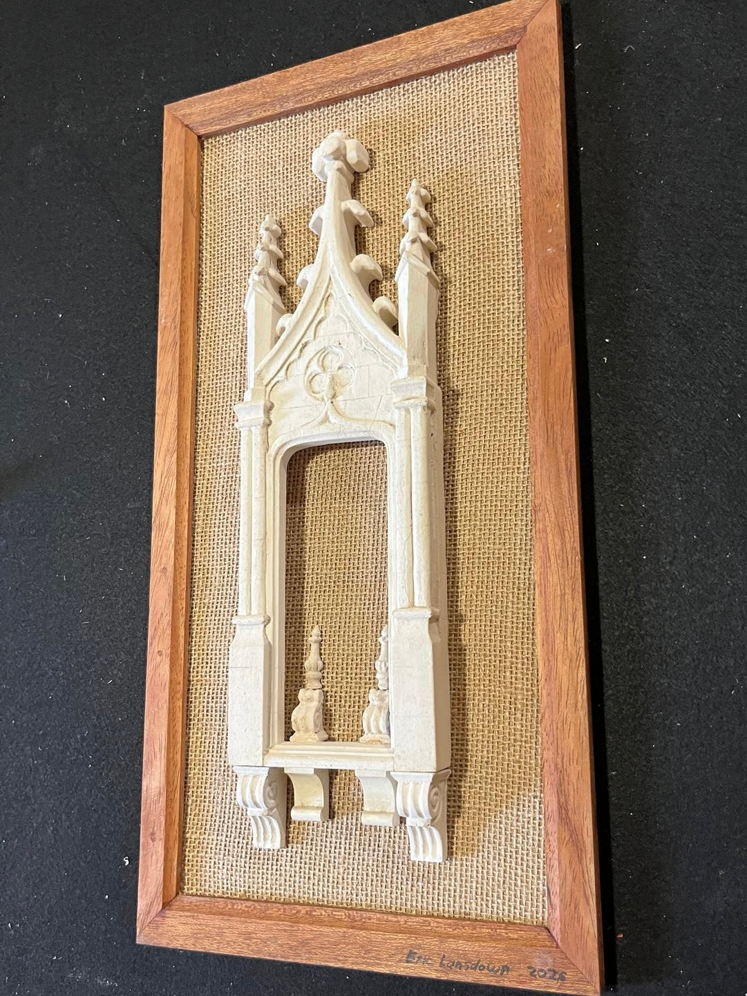 Angled view of Architectural Archive No. 07 showing the depth of its hand-cast Gothic relief against woven hessian