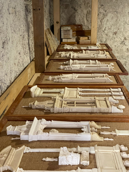 Six framed works from The Architectural Archive, Nos. 01–06, arranged in Eric Lansdown’s studio with plaster and resin castings on woven hessian